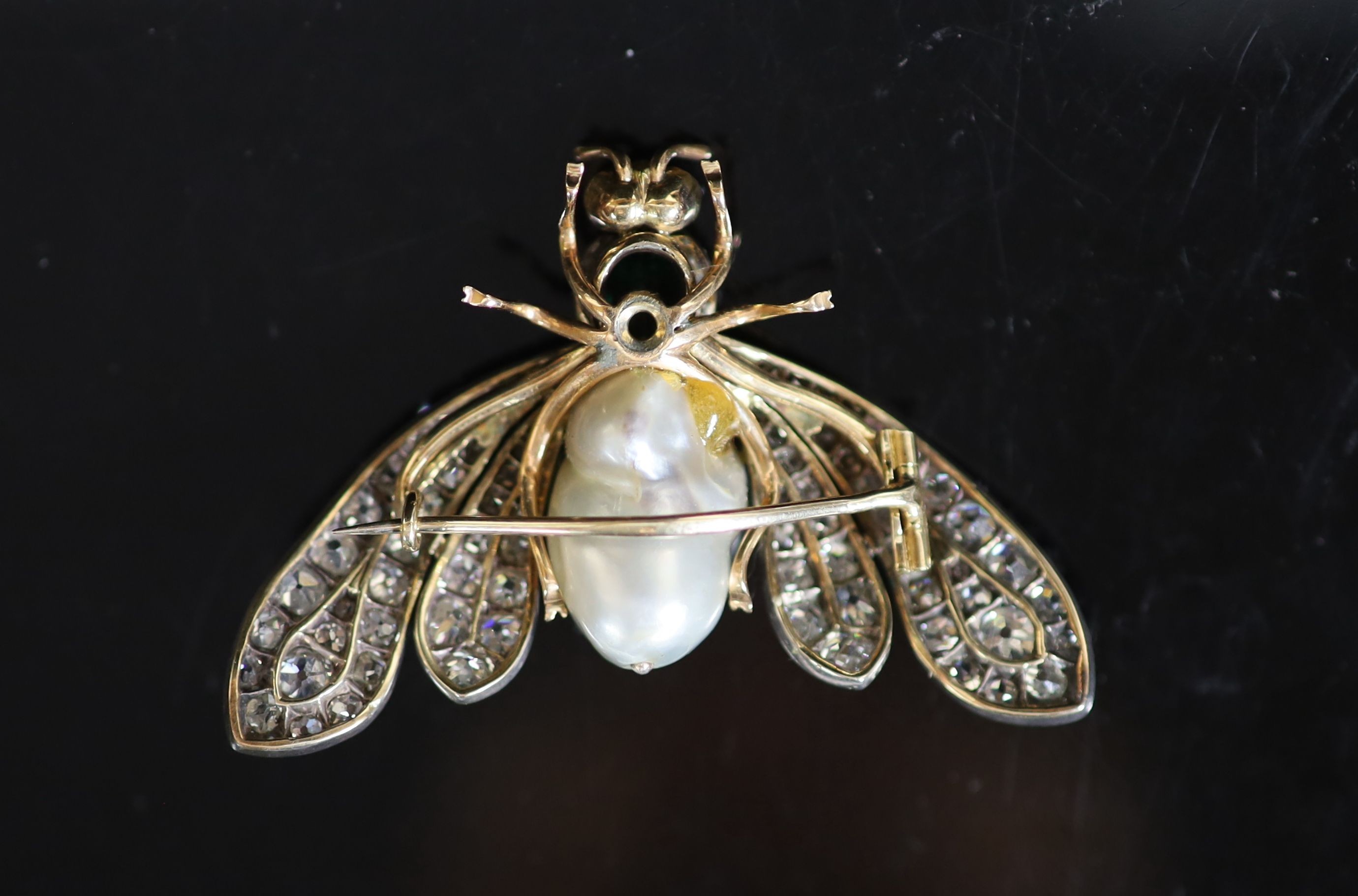 A cased late Victorian gold, baroque pearl, emerald ruby and graduated old mine cut diamond set bee brooch